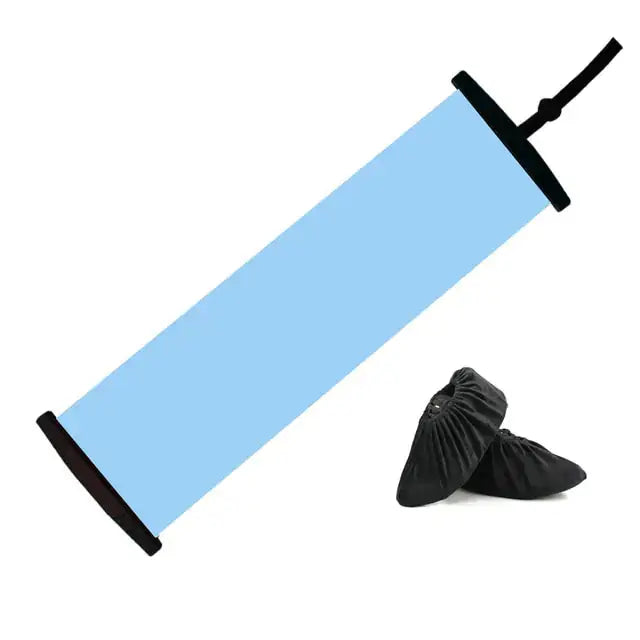 a pair of black shoes sitting next to a blue tube