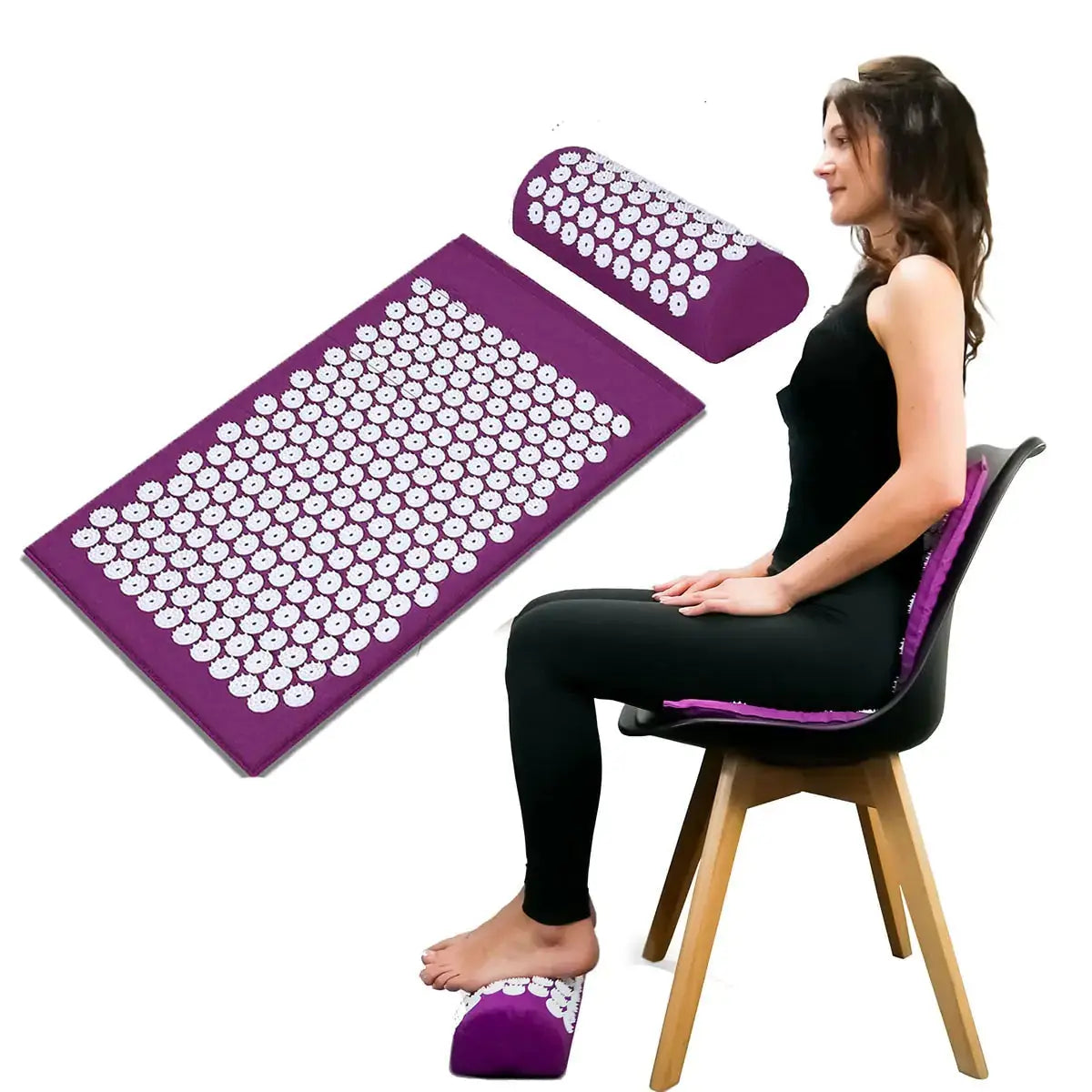 a woman sitting on top of a chair next to a purple mat