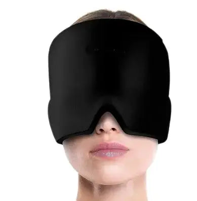 a woman wearing a black mask with her eyes closed