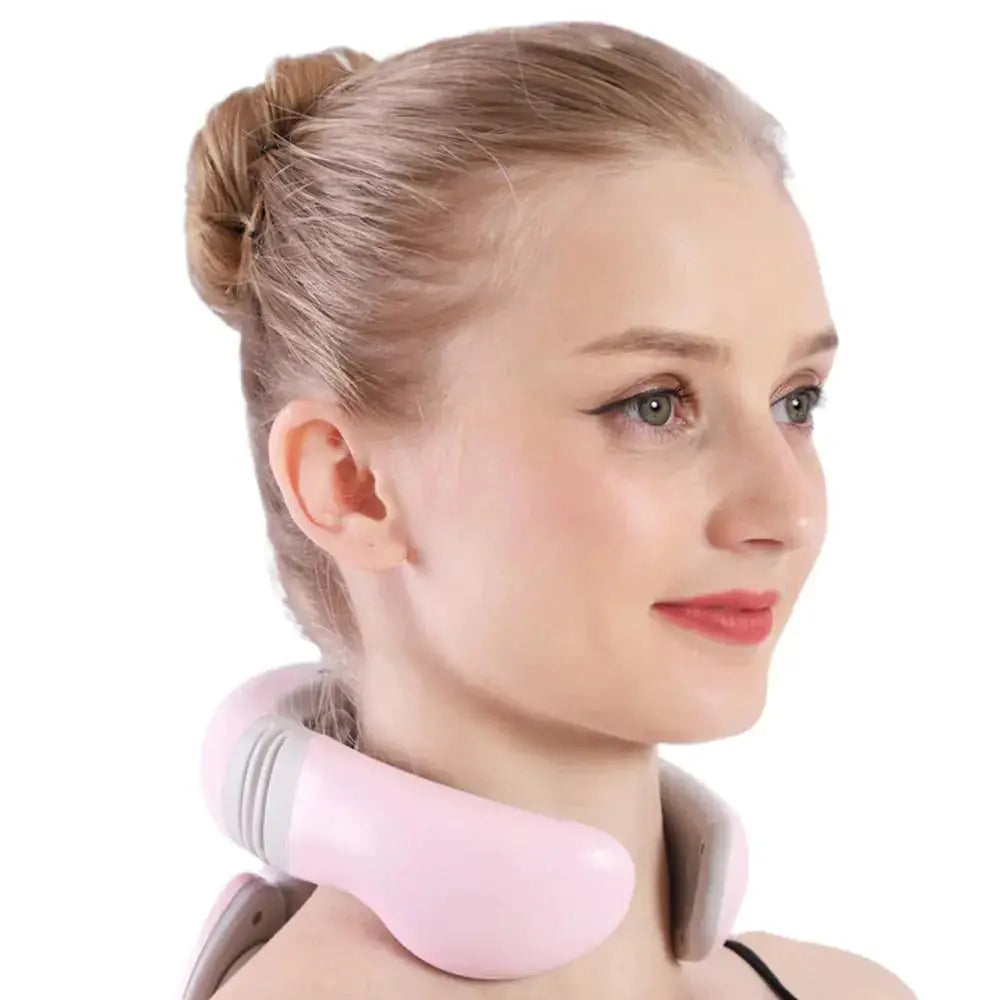 a woman with a pink neck massager on her neck