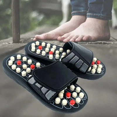 a pair of black sandals with red and white beads on them