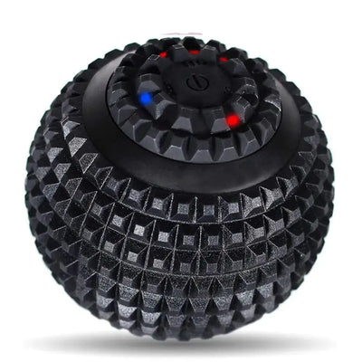 Black textured electric massage ball with LED indicator lights and central power button, designed for deep tissue therapy and muscle relaxation.