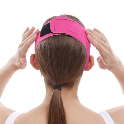 a woman with a pink visor on her head