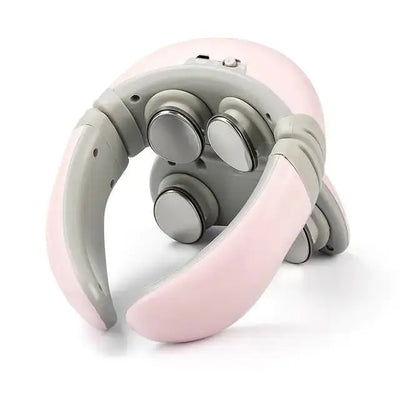 a pink and gray headphone sitting on top of a white surface